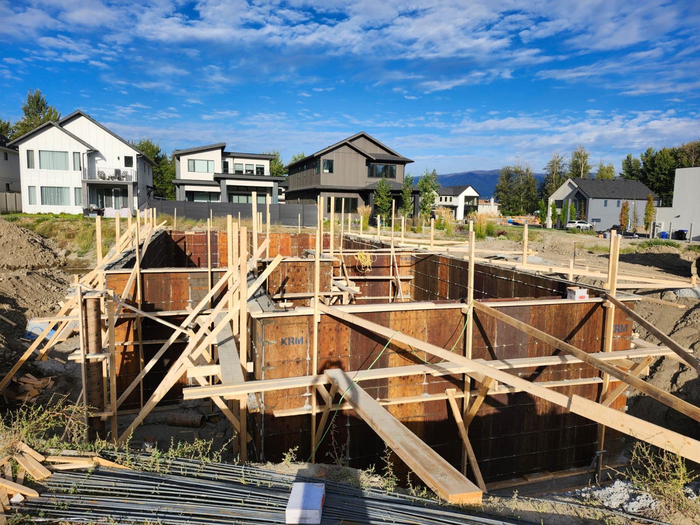 Concrete foundation forms braced and ready for the pour on a new custom home.